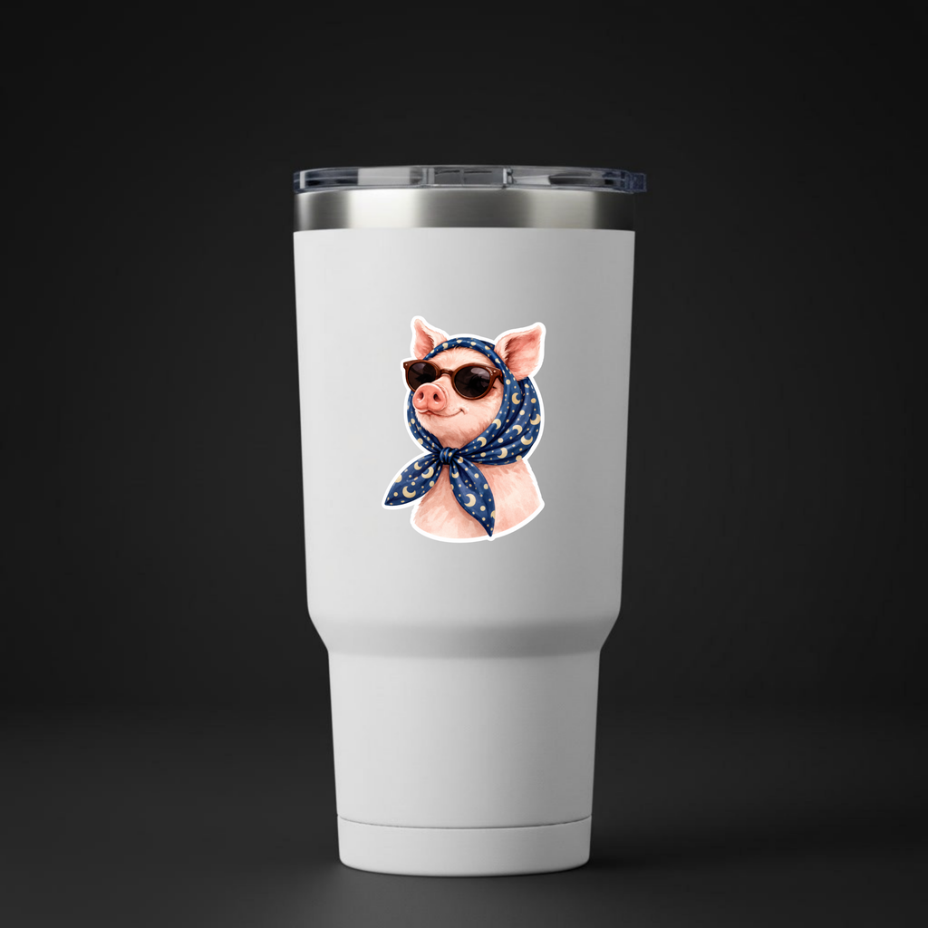 White tumbler with a pig wearing sunglasses and a bandana on a black background