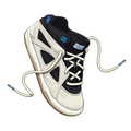 White and black sneaker with blue accents on a white background